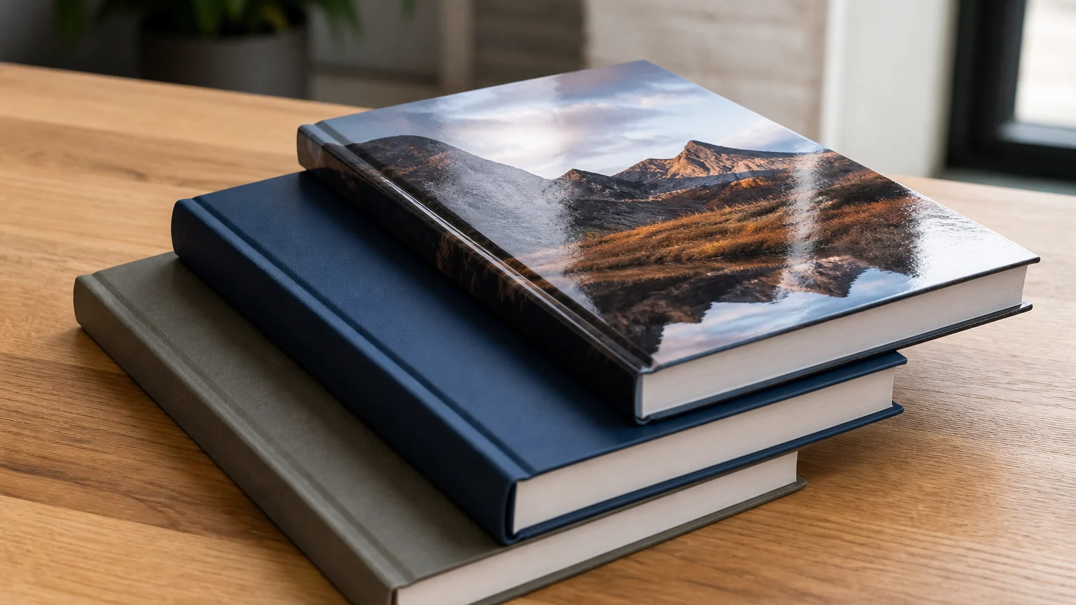 Matt and gloss laminated custom book covers displayed on a table.
