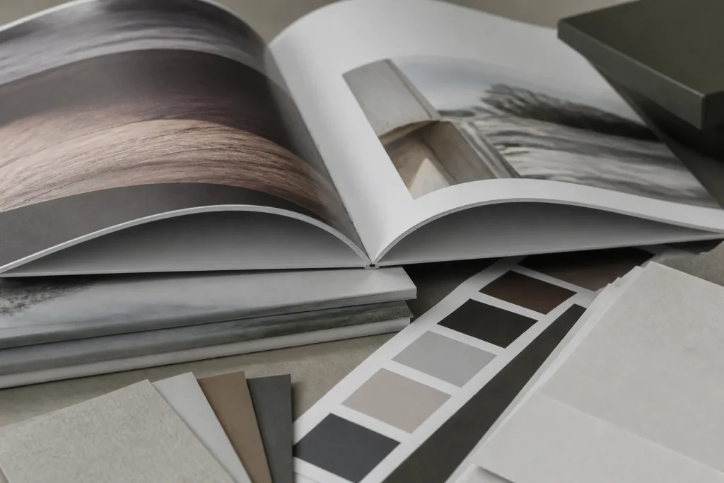 Open stapled booklet prototype with paper samples for print review for small quantity stapled booklet printing.