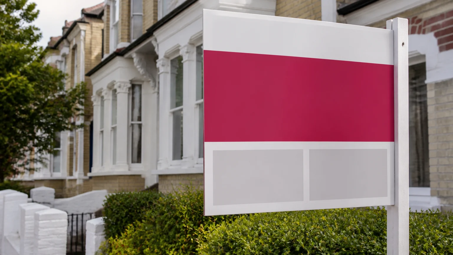 Printed estate agent board outside a UK residential property with clear contact layout