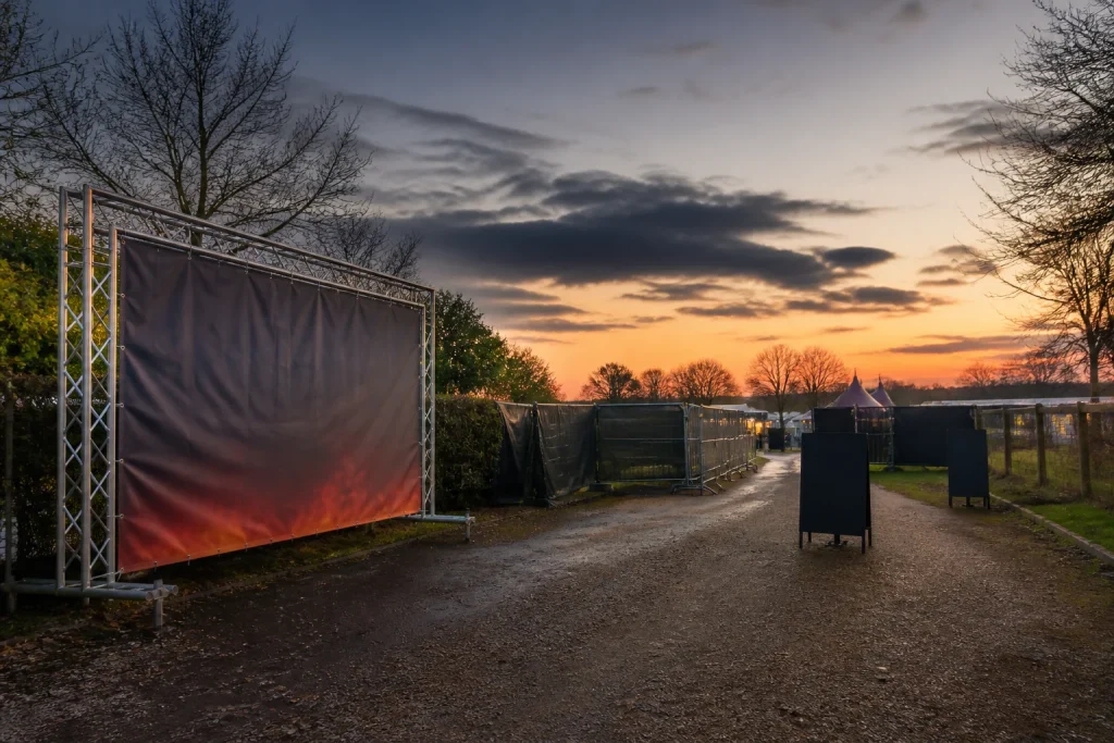 Outdoor event signage positioned along a Bonfire Night arrival route