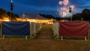 Bonfire Night event entrance with banners marking separate queue and collection routes