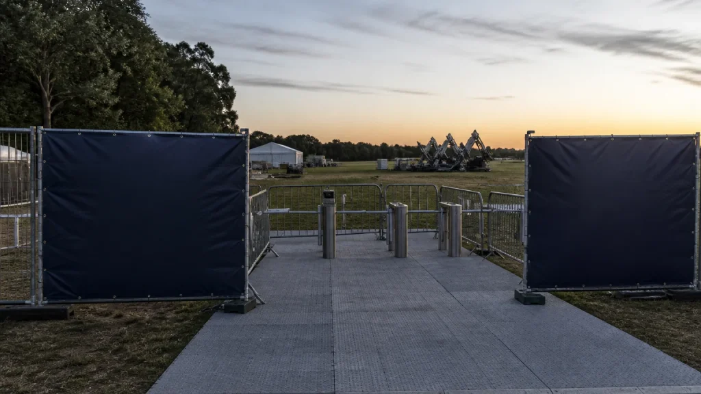 Fireworks Night banners positioned at a split timed-entry route